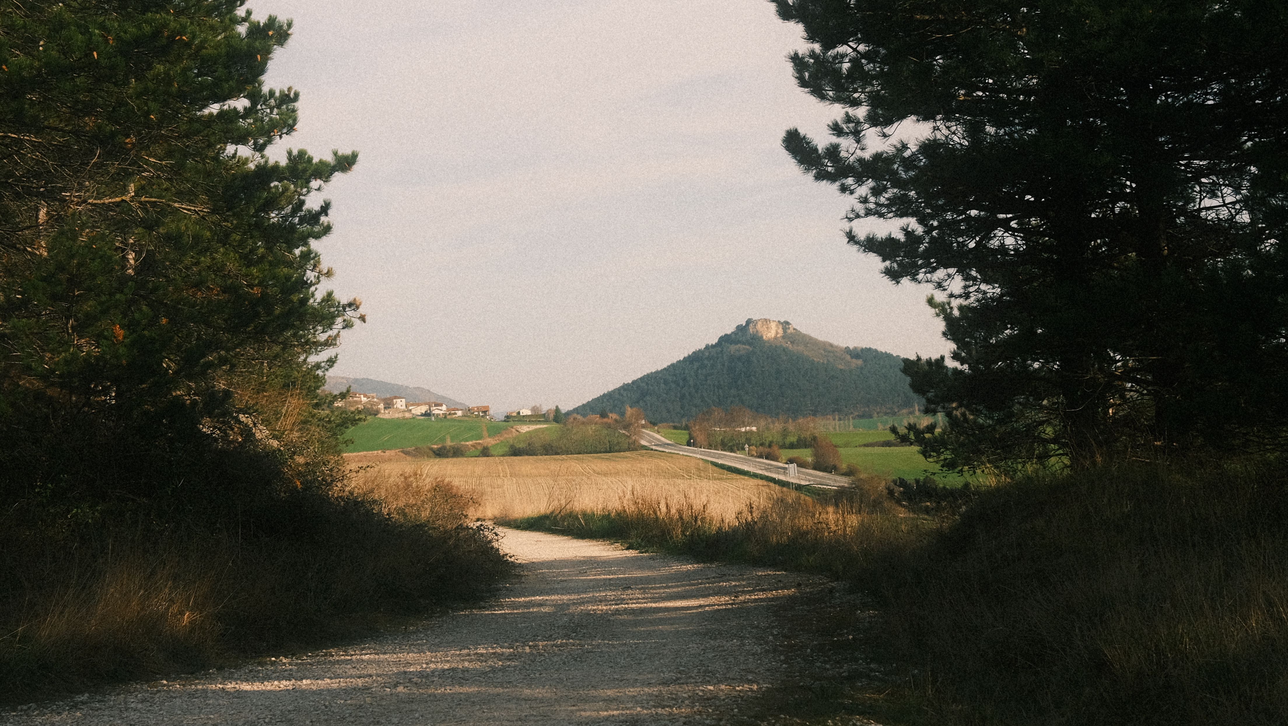 A car driving on a scenic road in the Spanish countryside