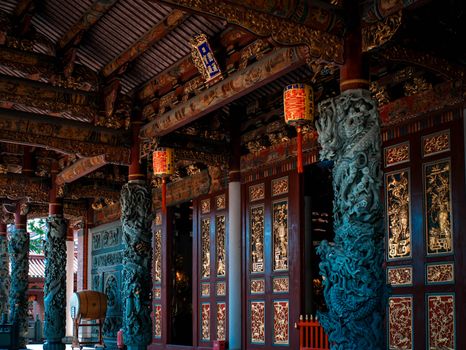 Explore the rich carvings and ornate decorations of a traditional Asian temple showcasing cultural artistry.