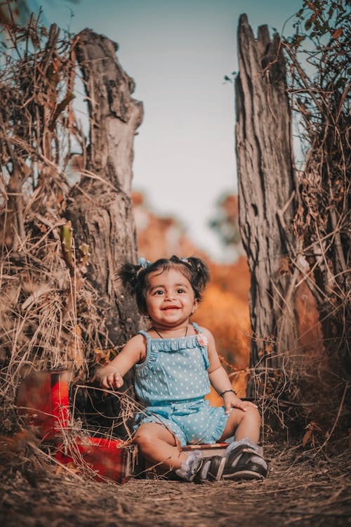 Little Girl in Blue Clothing Smiling