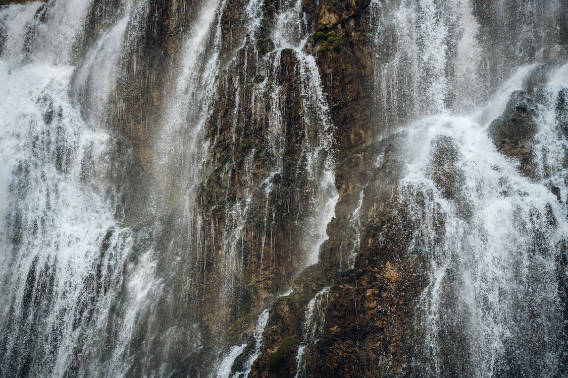 Majestic Waterfall Cascading Over Rocks · Free Stock Photo