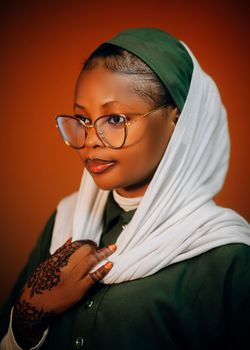 Elegant portrait of a woman in Hausa attire, showcasing cultural heritage.