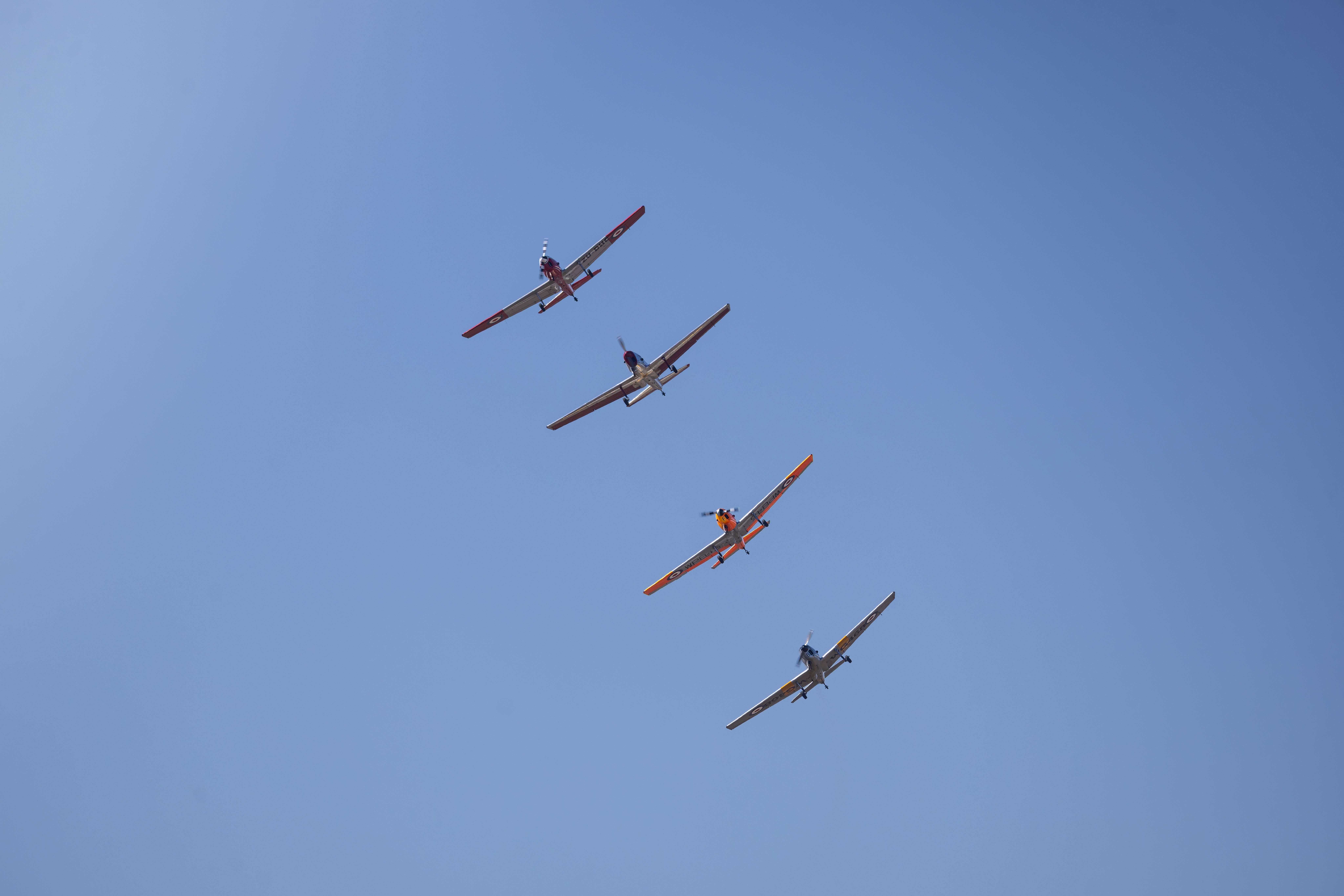 Aerobatic Airshow with Four Planes in Blue Sky · Free Stock Photo