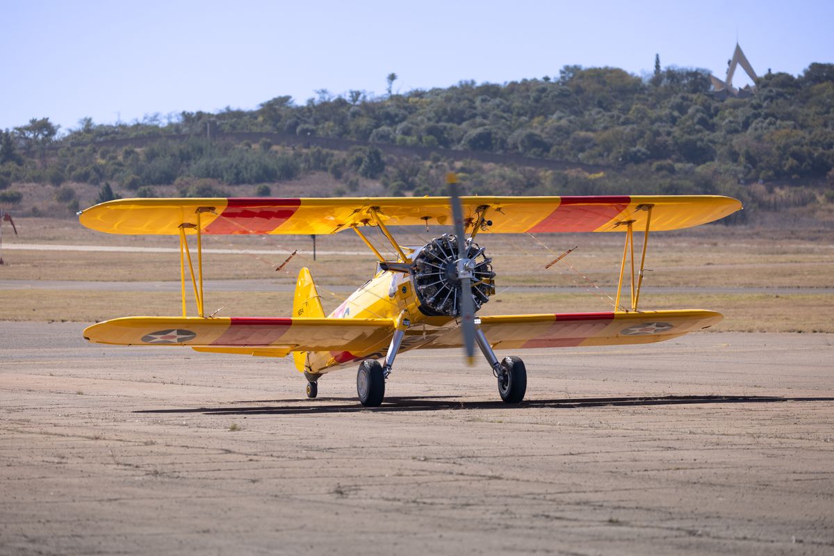 A Vintage Plane in an Airfield · Free Stock Photo