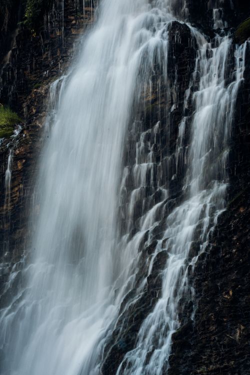 Free A powerful waterfall flowing down a rugged cliff, showcasing nature's beauty and strength. Stock Photo