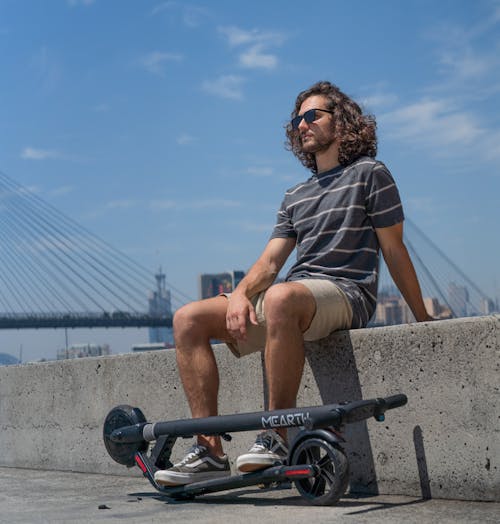 Free stock photo of bridge, electric scooter, man