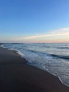 Tranquil evening scene capturing the serene waves and sunset at Durrës Beach, Albania.