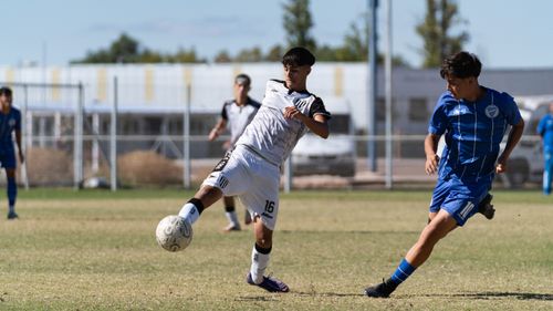 Free Youth soccer players in action during a vibrant outdoor match, showcasing dynamic sportsmanship. Stock Photo