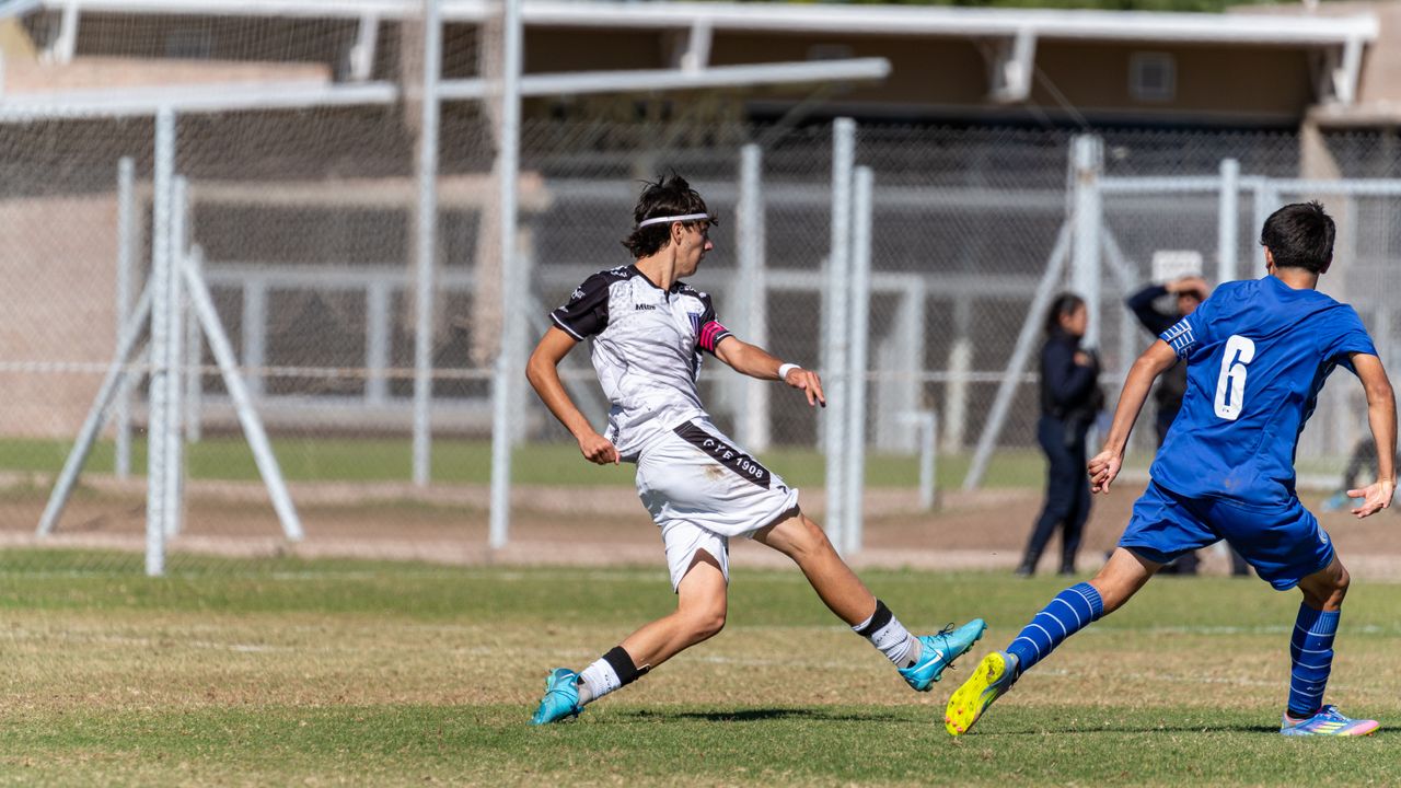 dynamic action shot of two young soccer players competing intensely in