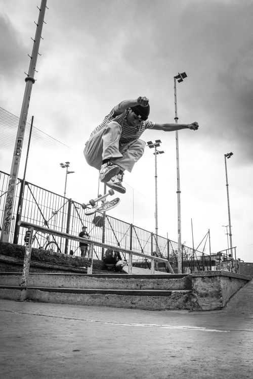 Free Dynamic shot of a skateboarder performing a trick in a Bogotá skatepark. Street culture vibe. Stock Photo