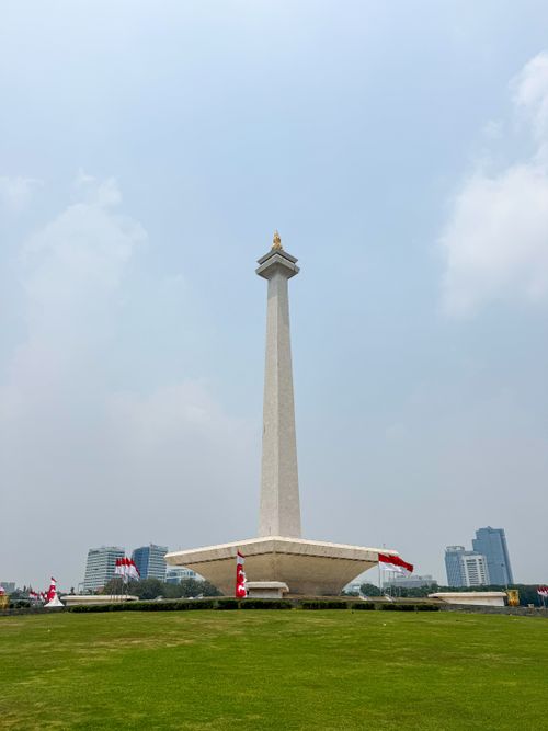 Free The iconic National Monument in Jakarta with clear skies and surrounding buildings in view. Stock Photo