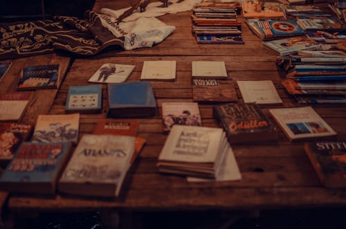 Collection of Books on Wooden Surface