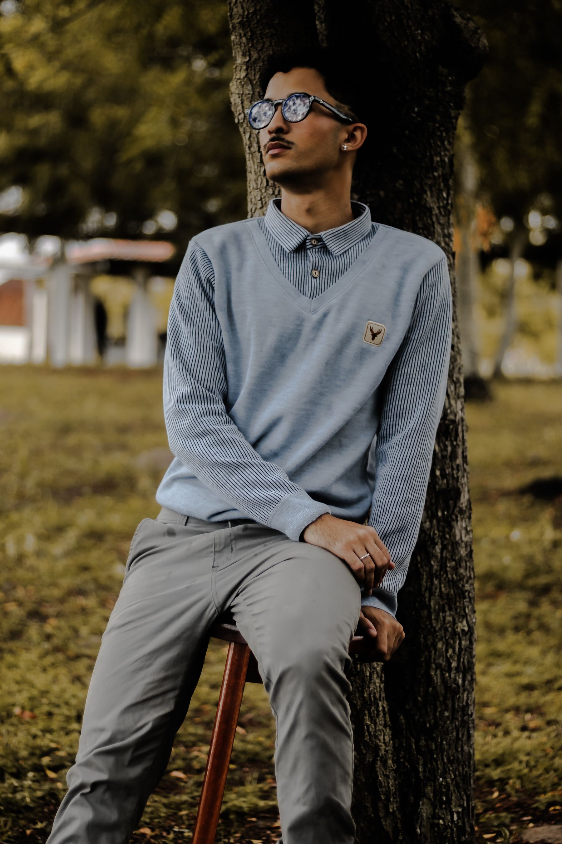 Man wearing relaxed outdoor-inspired menswear in natural daylight