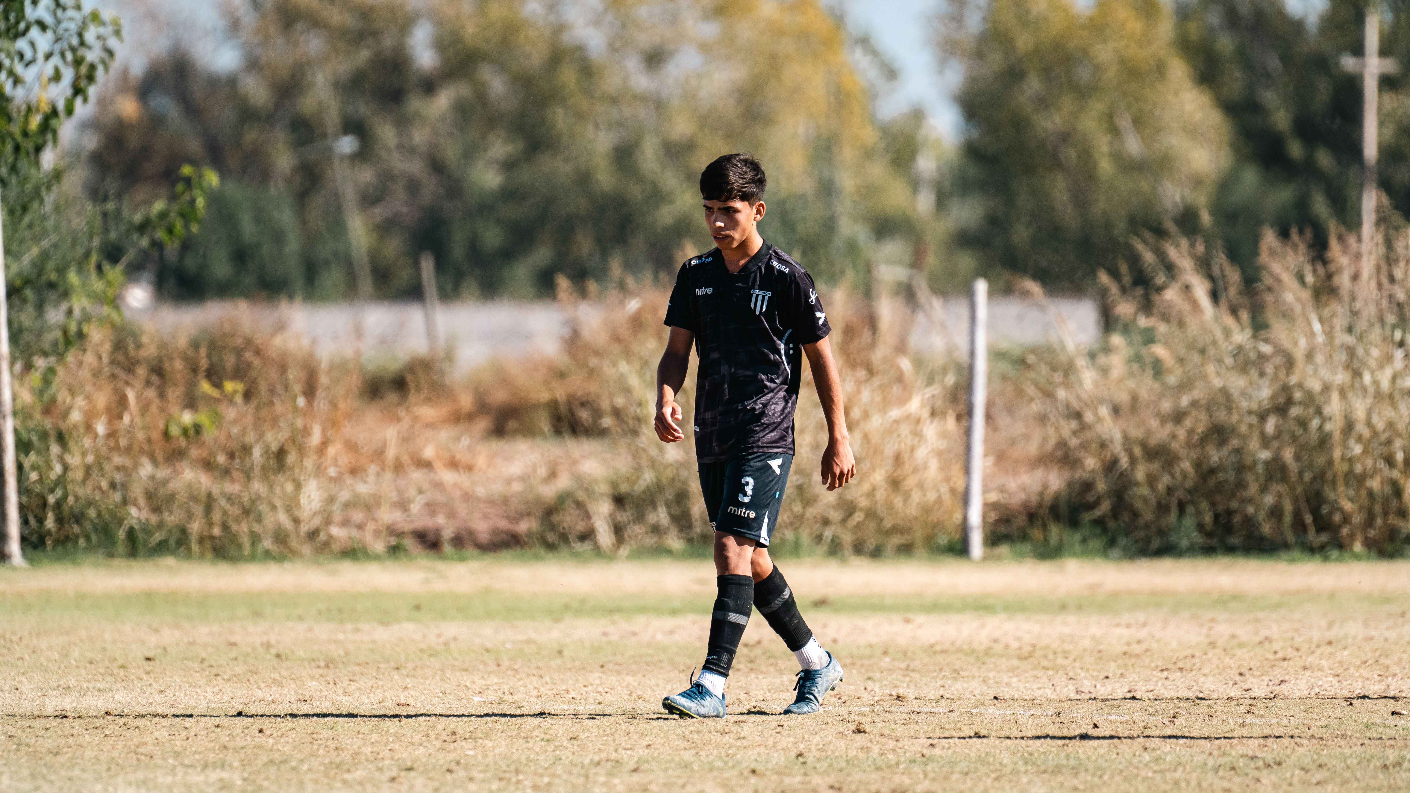 Young Soccer Player on Field in Daylight