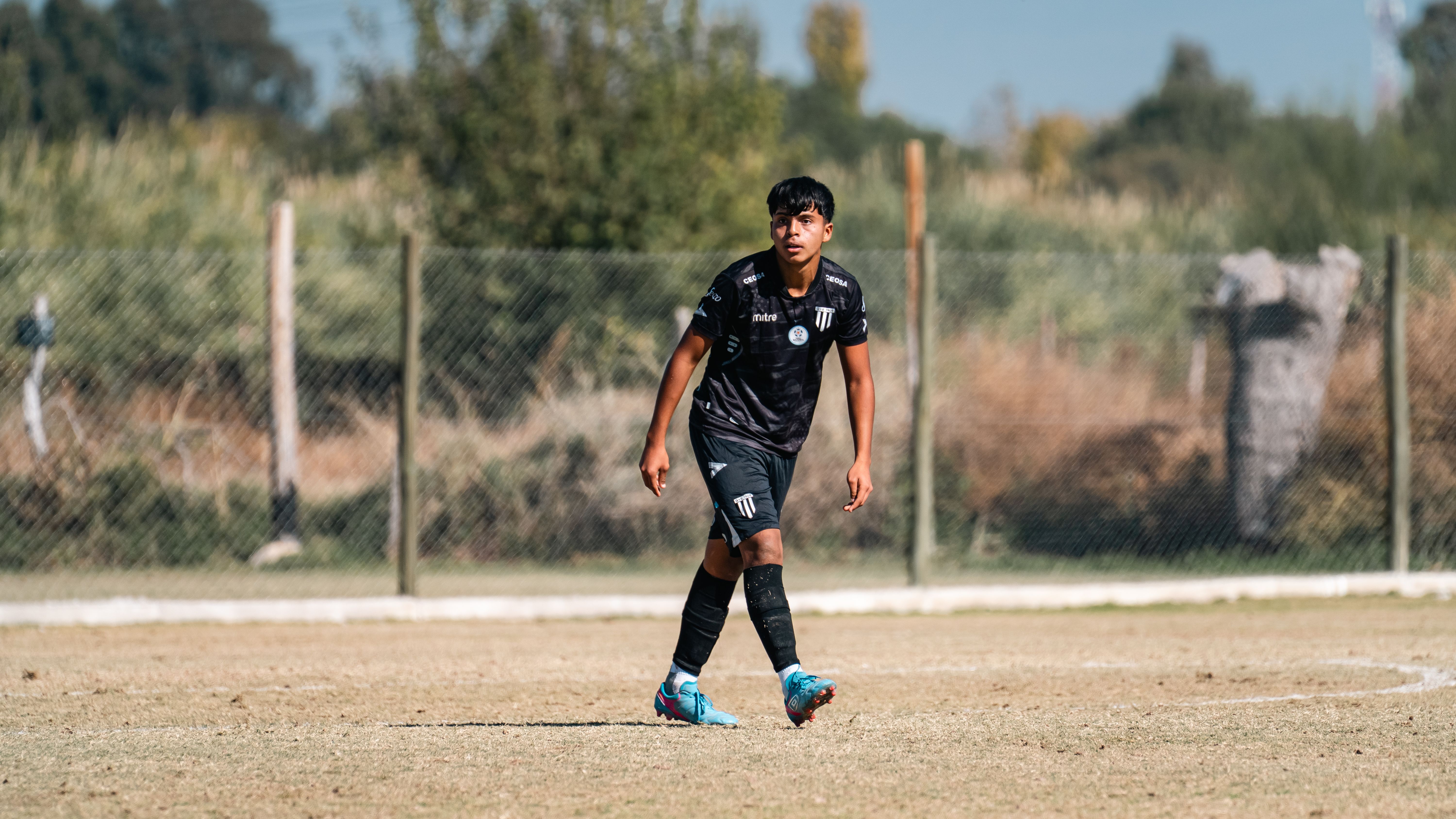 Young Soccer Player on Field in Action