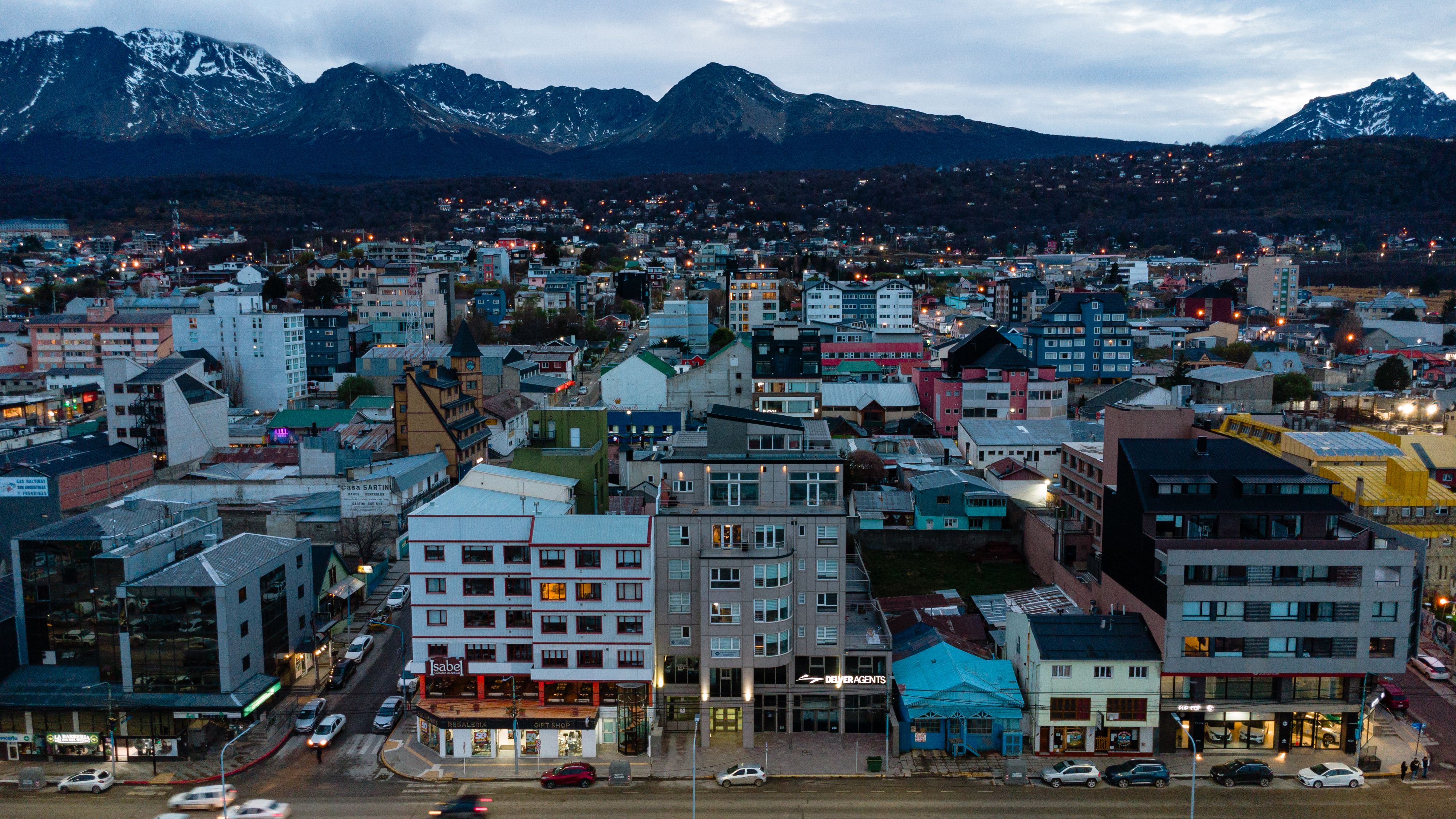 Ultimate Iguassu Falls Brazilian Side: Macuco Safari, Helicopter Flight and Bird Park Review 2026 - Stunning aerial view of Ushuaia, Argentina, with the Andes Mountains in the background at dusk.