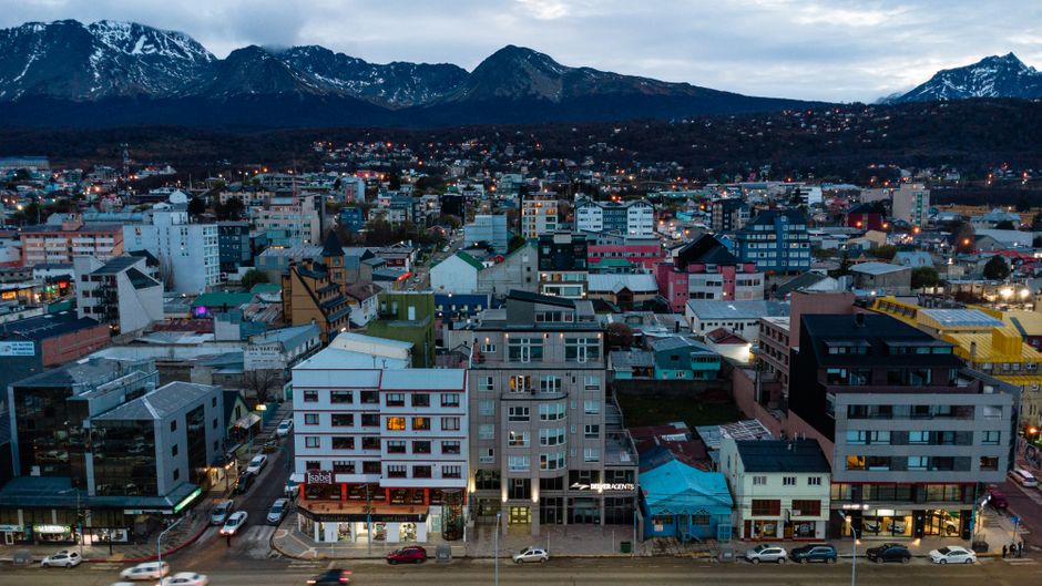 Ultimate Iguassu Falls Brazilian Side: Macuco Safari, Helicopter Flight and Bird Park Review 2026 - Stunning aerial view of Ushuaia, Argentina, with the Andes Mountains in the background at dusk.
