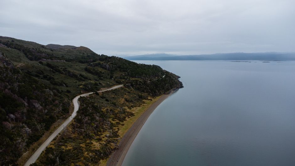 Unbeatable Helicopter over Iguazu Falls Transfer at Puerto Iguazú Hotels Review 2026 - Aerial view of a winding road by the coast in Ushuaia, Argentina's Tierra del Fuego Province.