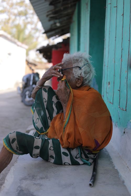 Free Portrait of a centenarian Indian woman in Lalakapa reflecting life, wisdom, and cultural heritage. Stock Photo