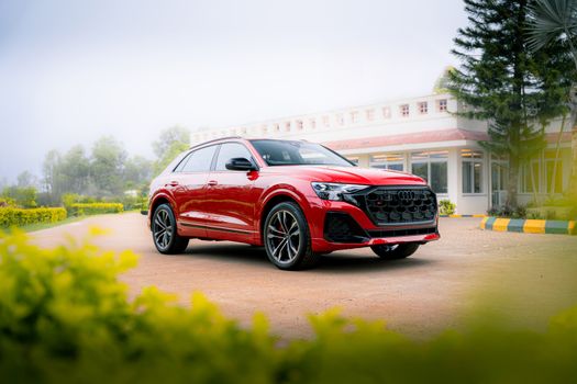 Beautiful red car against a scenic backdrop, perfect for car enthusiasts and automotive design lovers.