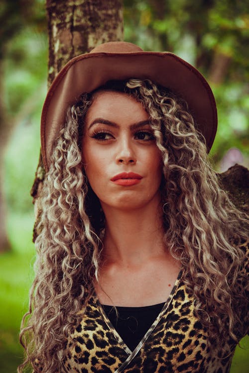 Woman Wearing Leopard Print Top and Cowboy Hat