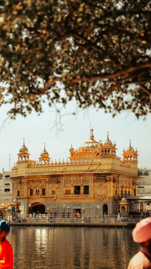 Free Beautiful view of the Golden Temple in Amritsar, India, under clear blue skies. Stock Photo