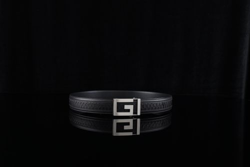 Free Sleek black leather belt featuring a modern metallic buckle, perfect for formal attire. Stock Photo