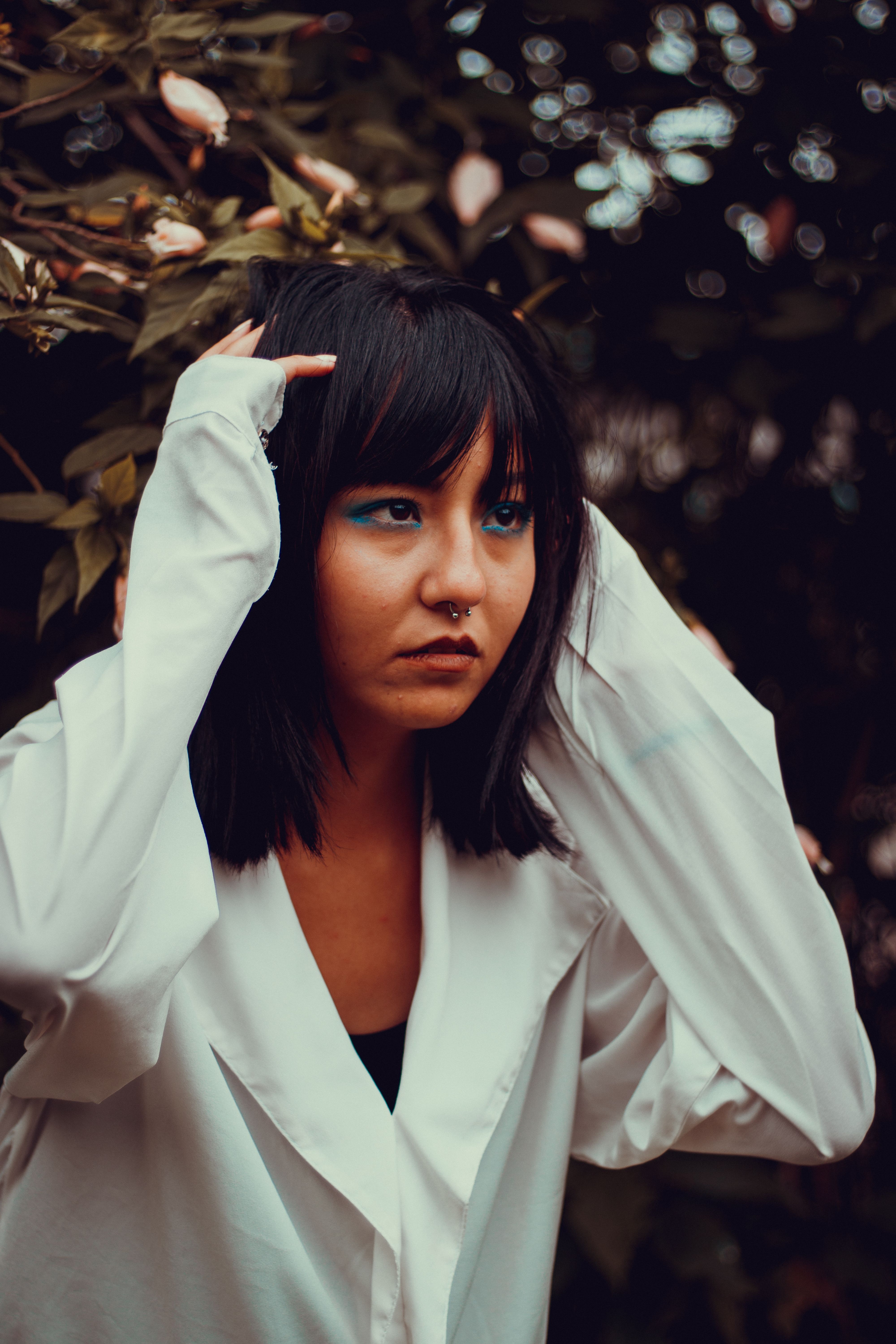 Woman in White Long Sleeve Shirt Holding Green Plant · Free Stock Photo