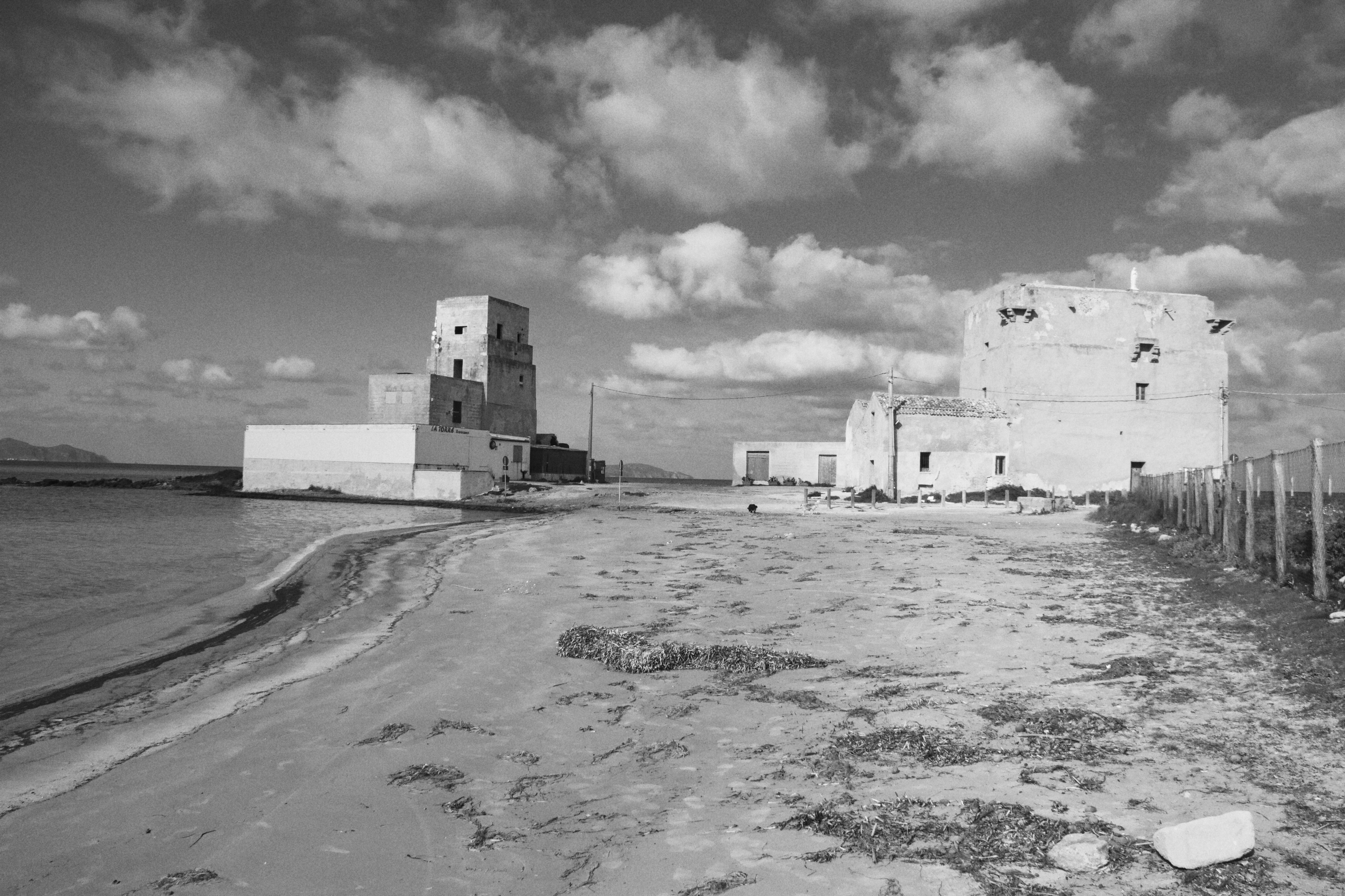 Black and white image of historic buildings on the Trapani coast, Sicily.
