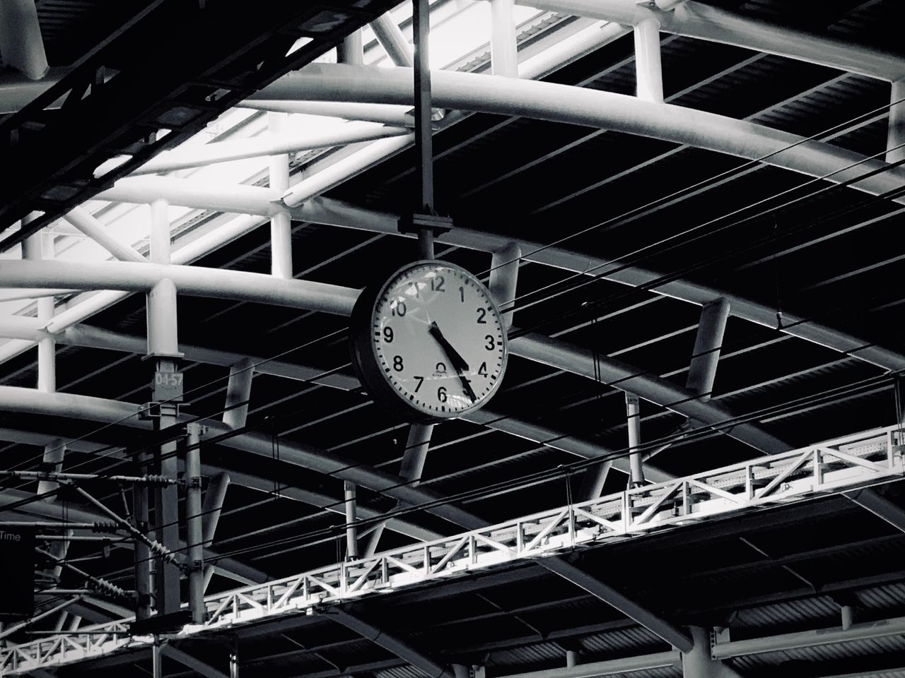 a striking black and white image of a metro station in dhaka featuring