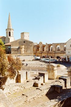 View of the ancient Roman amphitheater in Arles, France, on a sunny day.
