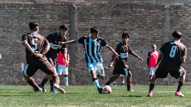 Youth soccer players compete fiercely during an outdoor match.