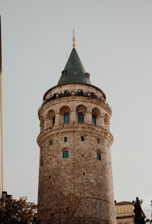 Free View of the historic Galata Tower in Istanbul with a clear sky backdrop. Stock Photo