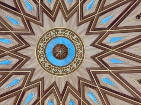 Captivating view of an Islamic geometric ceiling in Madinah, showcasing artistic craftsmanship.