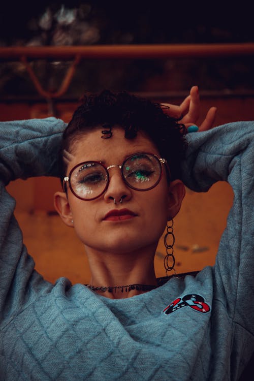 Woman in Gray Sweater Wearing Black Framed Eyeglasses