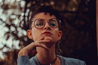 Woman in Gray Sweater Wearing Black Framed Eyeglasses