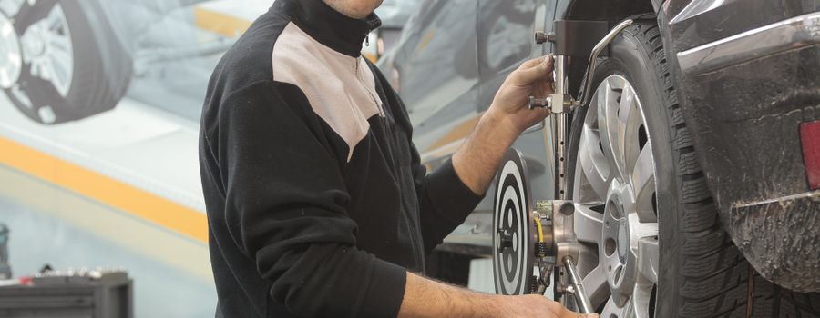 Technician working on Sprinter with diagnostic equipment