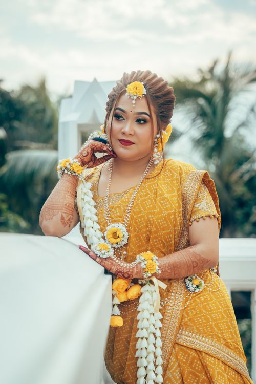 Free Stunning portrait of a South Asian bride in traditional attire with floral details, captured outdoors. Stock Photo