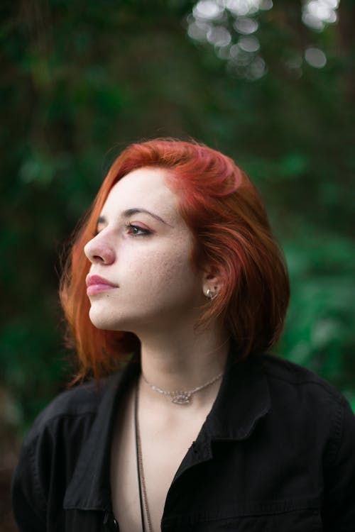 Woman in Black Top and Silver Necklace