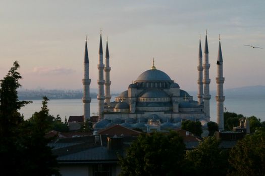 The iconic Sultan Ahmed Mosque with six minarets at sunset, Istanbul, Turkey.