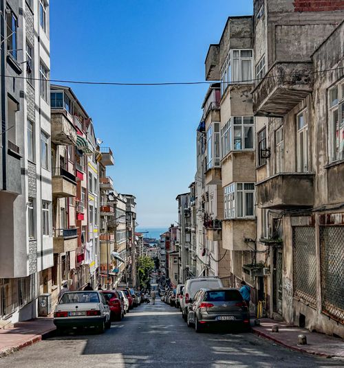 Free Bustling urban street in Istanbul leading down to the sea on a sunny day. Stock Photo