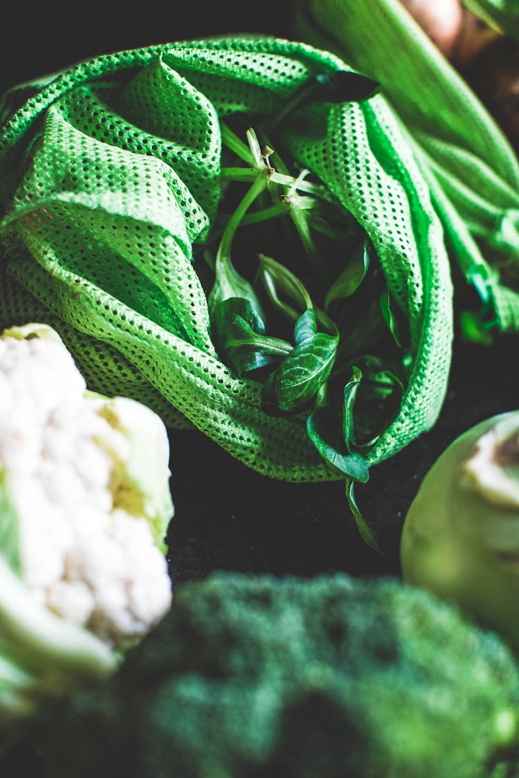 Fresh Cauliflower And Broccoli Near Bag With Spinach