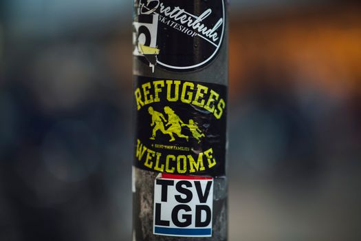 Street metal pillar with various stickers