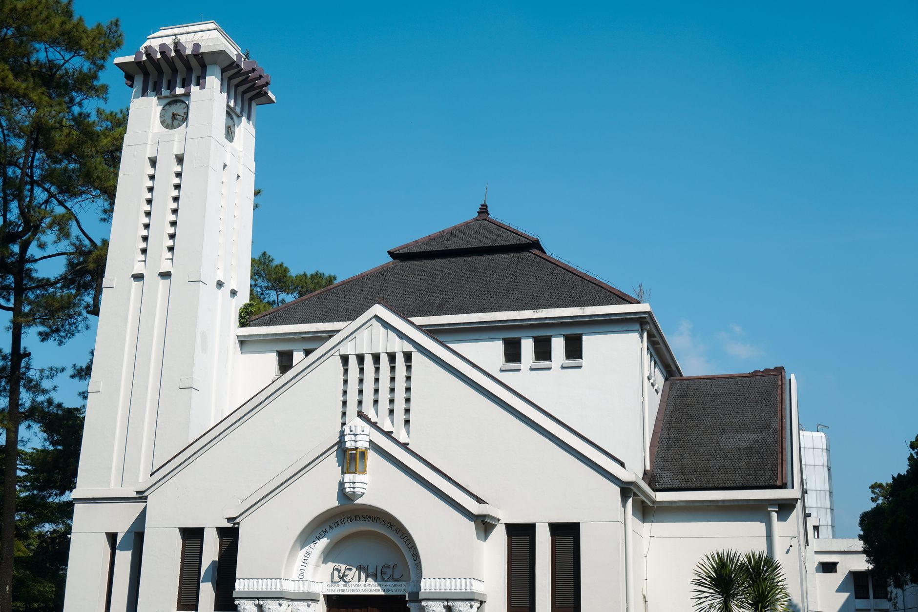 Exterior view of the historic Bethel Church with blue sky in Bandung, Indonesia.