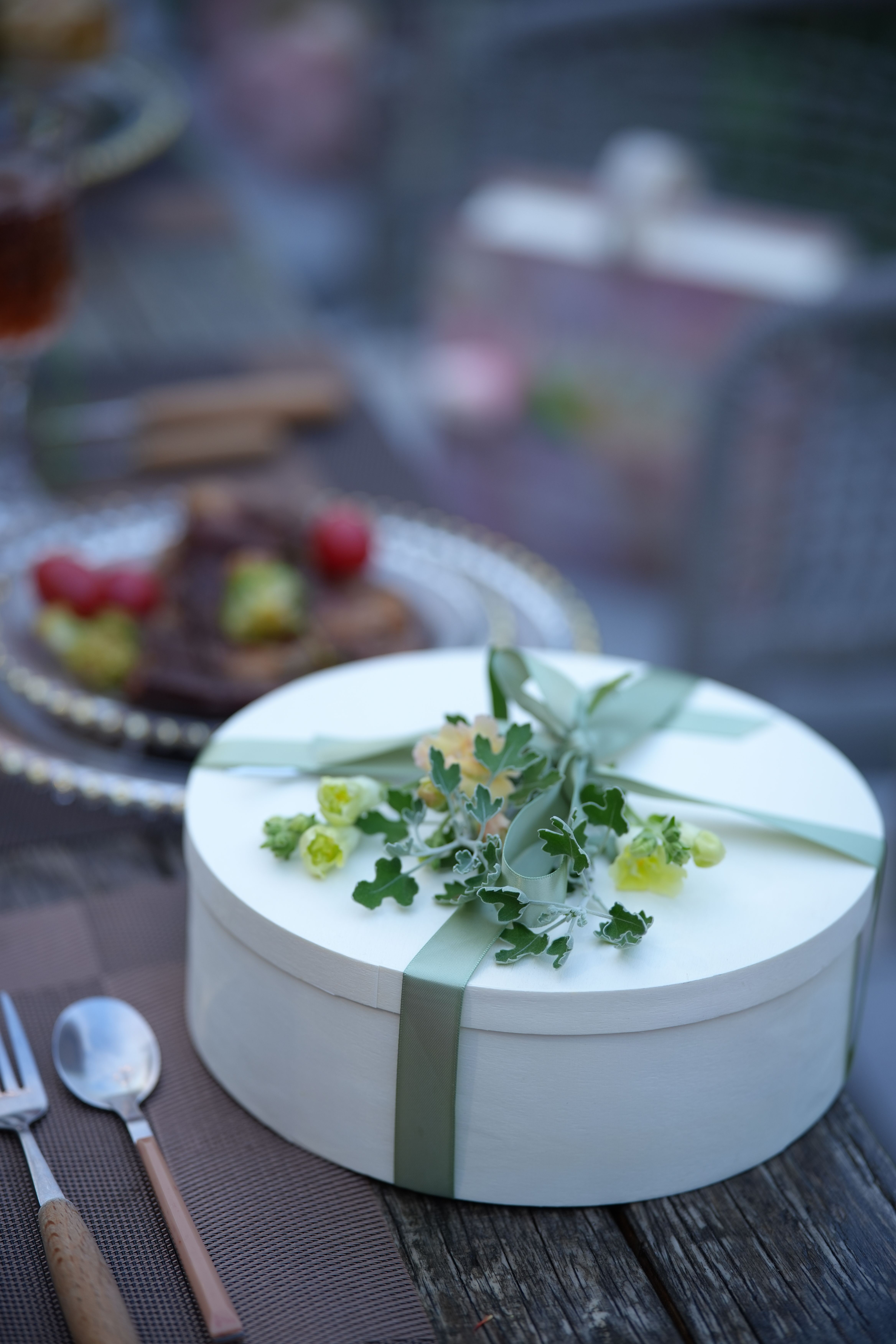 elegant gift box with floral decoration on table