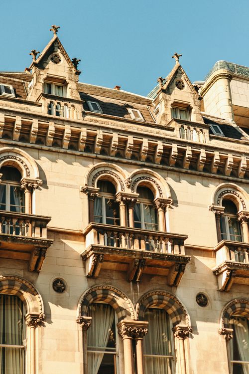 Free Detailed view of Victorian architecture facade with ornate windows in Dublin under a clear blue sky. Stock Photo