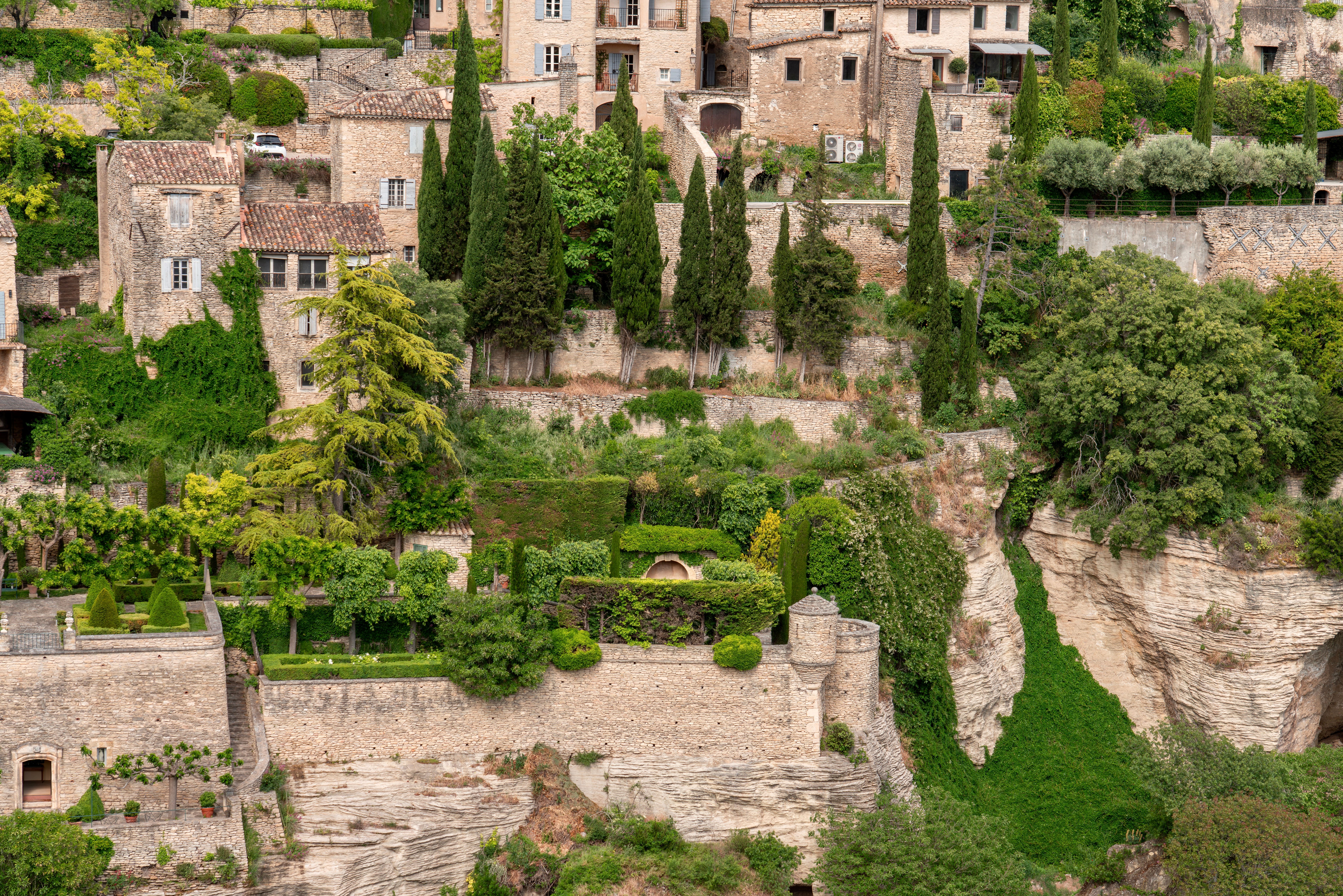 Terraced vineyards above a stone village on the southern slopes of the Troodos