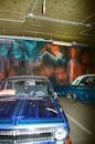 Vintage Cars at a Parking Lot With Graffiti on the Walls