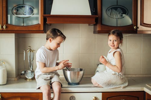 Free Photo of Kids Playing on Kitchen Counter Top Stock Photo
