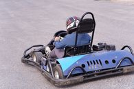 A person driving a go-kart on a track in Gazipur, Bangladesh, showcasing speed and excitement.