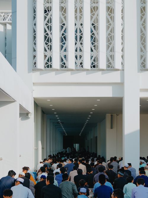 Free A large group of people praying together at an outdoor mosque in Tangerang, Indonesia. Stock Photo